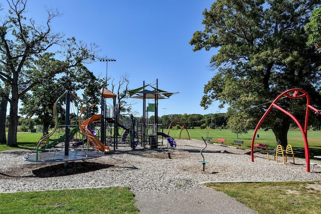 community jungle gym with a lawn