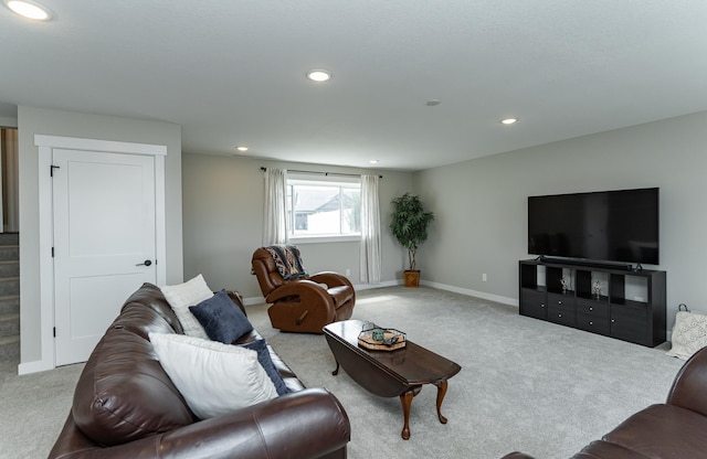 carpeted living area with baseboards, recessed lighting, and stairs