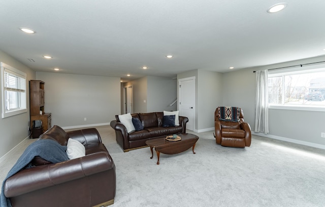 carpeted living area featuring recessed lighting, stairs, and baseboards