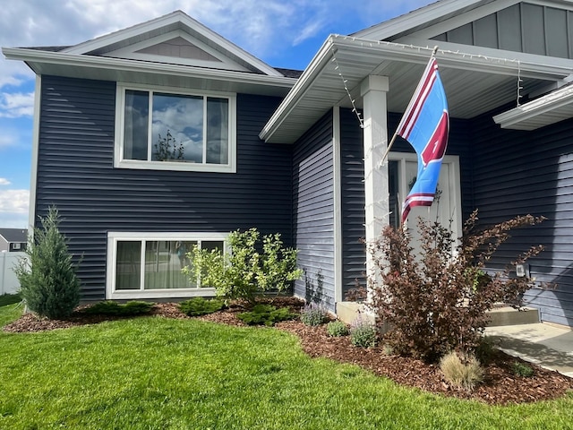 view of home's exterior featuring a lawn