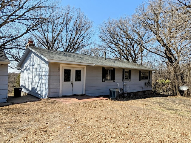 1433 Ridgeview Dr, Montevideo, MN 56265 - rear view of property featuring a chimney and central air condition unit