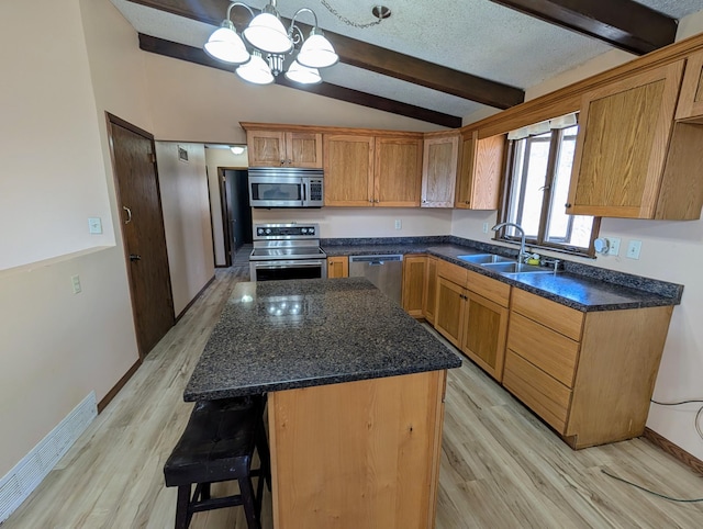 1433 Ridgeview Dr, Montevideo, MN 56265 - kitchen featuring appliances with stainless steel finishes, a sink, light wood-style flooring, and a chandelier