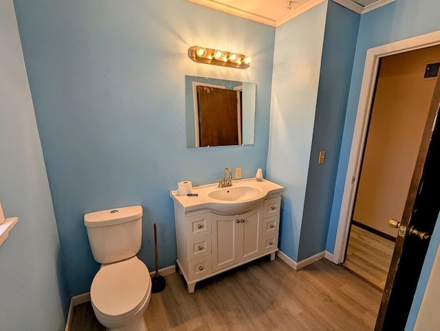 1433 Ridgeview Dr, Montevideo, MN 56265 - half bathroom with wood finished floors, toilet, vanity, and baseboards