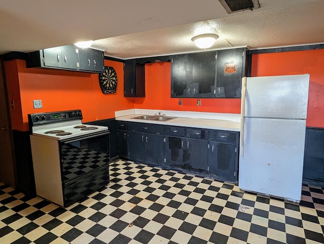 1433 Ridgeview Dr, Montevideo, MN 56265 - kitchen with electric stove, freestanding refrigerator, light flooring, a textured ceiling, and light countertops