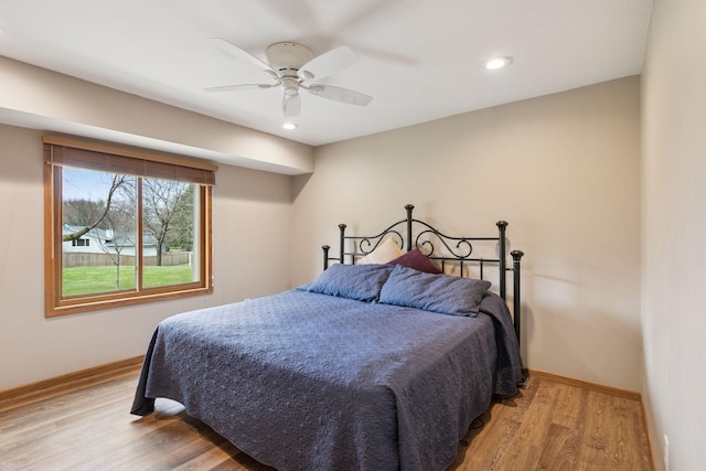 bedroom with ceiling fan, baseboards, light wood finished floors, and recessed lighting