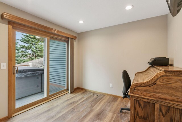 office featuring recessed lighting, light wood-style floors, and baseboards