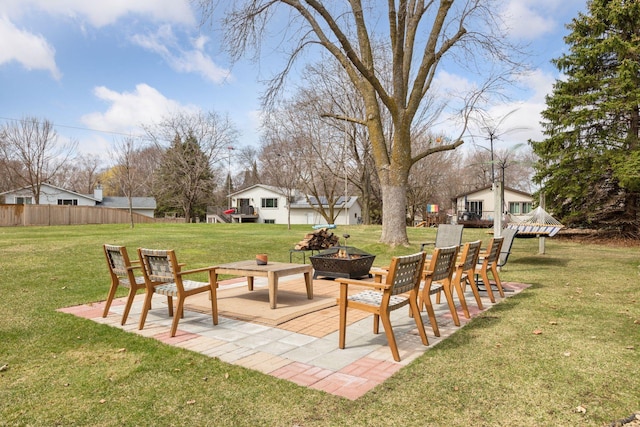 view of yard with a fire pit