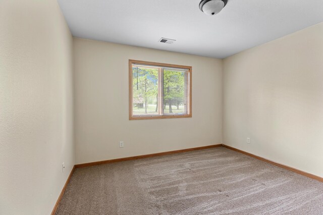 7051 Fox Rd, Baxter, MN 56425 - empty room featuring carpet flooring and baseboards
