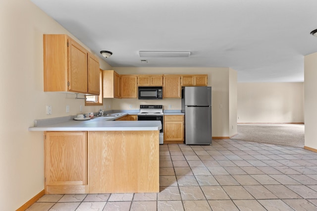 7051 Fox Rd, Baxter, MN 56425 - kitchen with freestanding refrigerator, range with electric stovetop, black microwave, light countertops, and a sink