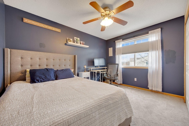 bedroom featuring carpet floors, a ceiling fan, baseboards, and visible vents