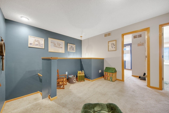 game room with baseboards, carpet flooring, and visible vents