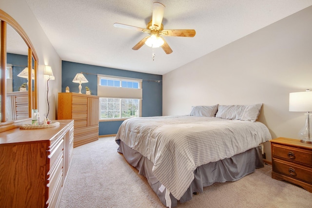 bedroom featuring light colored carpet and ceiling fan