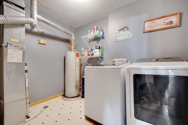 laundry room featuring laundry area, washer and dryer, a textured ceiling, tile patterned floors, and water heater