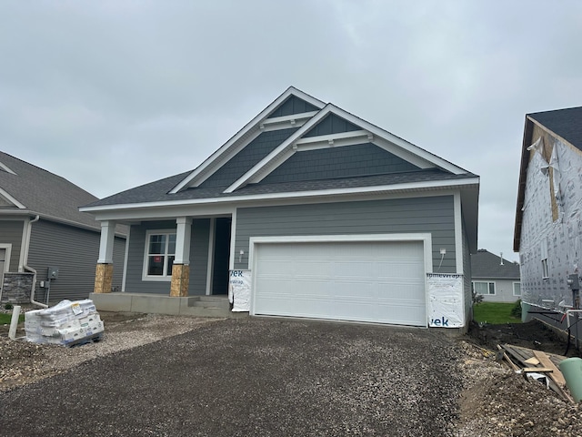 2063 Oakpointe Dr, Waconia, MN 55387 - craftsman inspired home with covered porch, asphalt driveway, and an attached garage