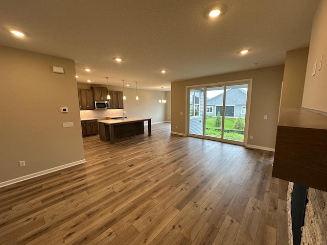2063 Oakpointe Dr, Waconia, MN 55387 - unfurnished living room with hardwood / wood-style flooring and recessed lighting