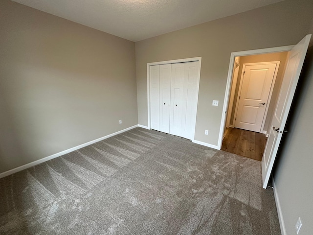 2063 Oakpointe Dr, Waconia, MN 55387 - unfurnished bedroom featuring carpet flooring and a closet