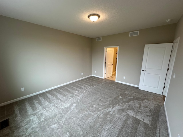 2063 Oakpointe Dr, Waconia, MN 55387 - unfurnished bedroom featuring carpet flooring and a textured ceiling