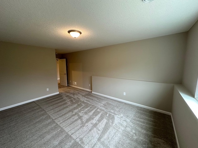 2063 Oakpointe Dr, Waconia, MN 55387 - empty room featuring carpet and a textured ceiling
