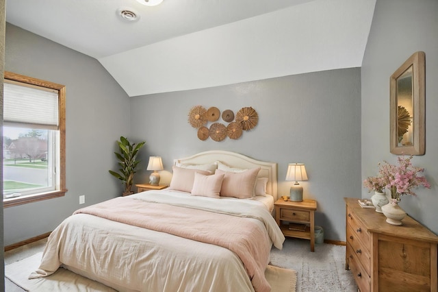 235 3rd St NE, Blooming Prairie, MN 55917 - bedroom with light colored carpet, vaulted ceiling, and baseboards