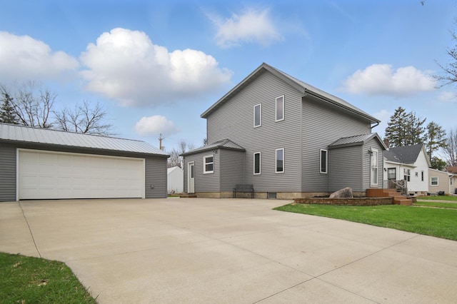 235 3rd St NE, Blooming Prairie, MN 55917 - exterior space with an outbuilding and a garage