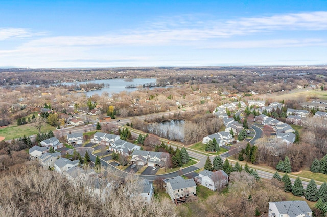 drone / aerial view featuring a residential view and a water view