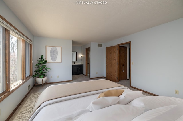 bedroom with visible vents, light carpet, baseboards, and multiple windows