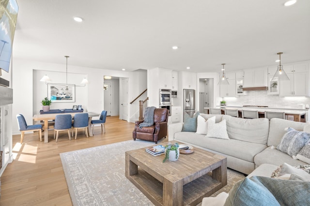 4429 Arbor Dr, Woodbury, MN 55129 - living room featuring light wood-style floors, recessed lighting, stairs, and baseboards