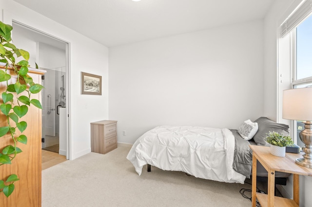 4429 Arbor Dr, Woodbury, MN 55129 - bedroom featuring light carpet and baseboards