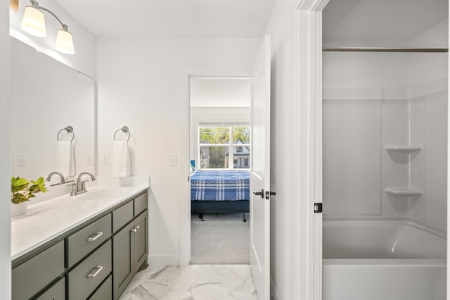 4429 Arbor Dr, Woodbury, MN 55129 - ensuite bathroom with vanity, marble finish flooring, bathing tub / shower combination, and baseboards