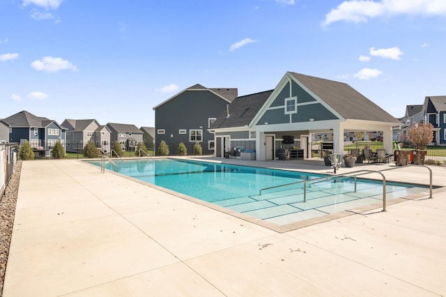 4429 Arbor Dr, Woodbury, MN 55129 - community pool with a patio area and a residential view