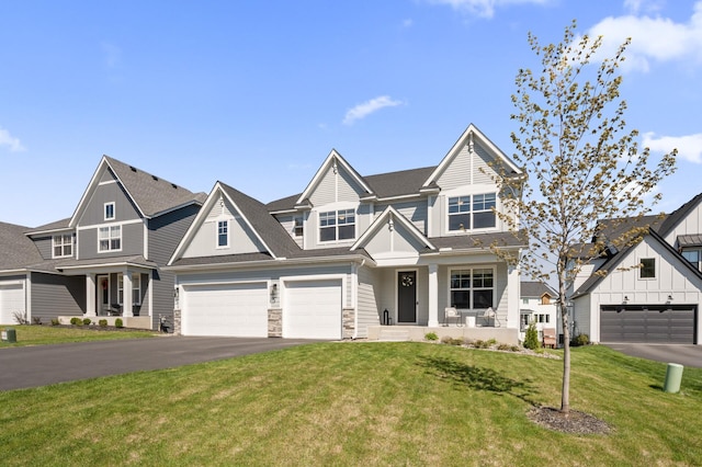 4429 Arbor Dr, Woodbury, MN 55129 - view of front of house with driveway, board and batten siding, a front lawn, stone siding, and a garage