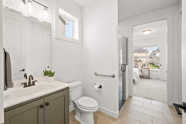 4429 Arbor Dr, Woodbury, MN 55129 - bathroom featuring vanity, plenty of natural light, toilet, and a shower stall