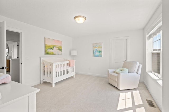 4429 Arbor Dr, Woodbury, MN 55129 - bedroom featuring light colored carpet, a nursery area, and baseboards