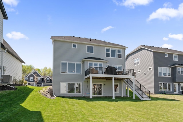 4429 Arbor Dr, Woodbury, MN 55129 - back of house with central air condition unit, stairway, a deck, and a yard