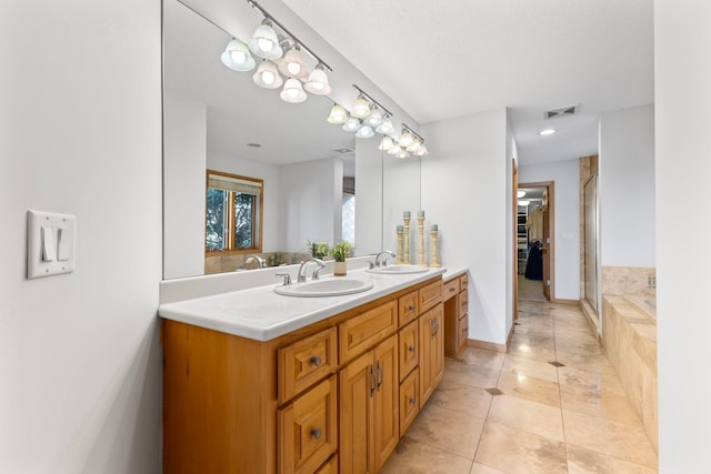 4101 Highwood Rd, Orono, MN 55364 - full bathroom featuring double vanity, a shower with door, a sink, and tile patterned flooring