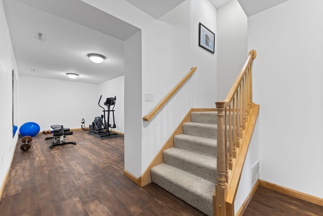 4101 Highwood Rd, Orono, MN 55364 - staircase with a textured ceiling, baseboards, visible vents, and wood finished floors