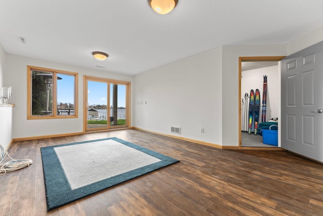 4101 Highwood Rd, Orono, MN 55364 - unfurnished living room featuring visible vents, baseboards, and wood finished floors