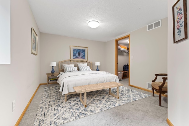 4101 Highwood Rd, Orono, MN 55364 - bedroom featuring light carpet, a textured ceiling, and a walk in closet
