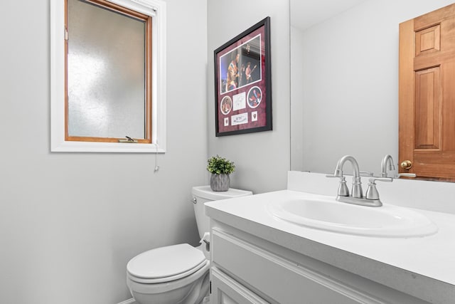 half bath with toilet and vanity