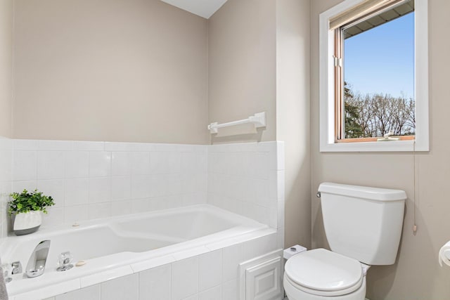 full bathroom with toilet and a bath