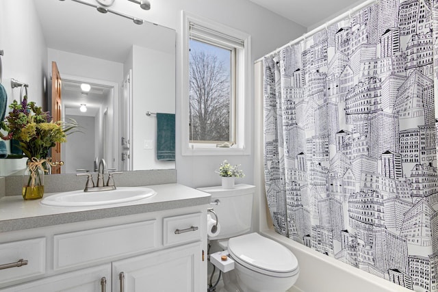 full bathroom featuring vanity, toilet, and shower / tub combo with curtain