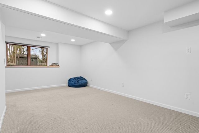 basement featuring baseboards, recessed lighting, and carpet floors