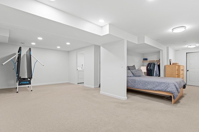 bedroom featuring washer / dryer, baseboards, recessed lighting, and light colored carpet