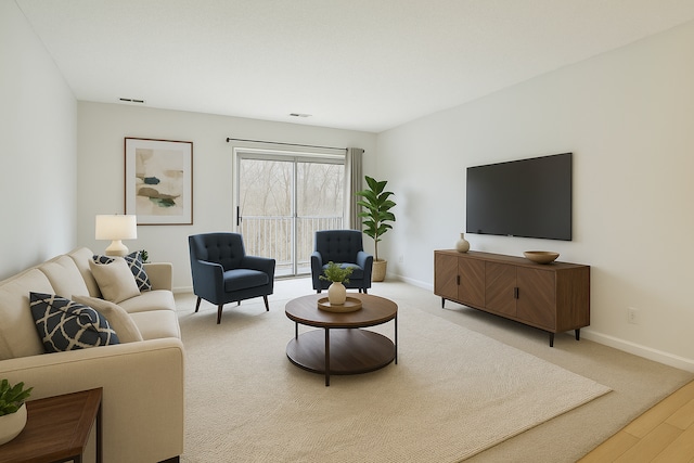 742 County Road F W Unit D, Shoreview, MN 55126 - living room featuring visible vents, wood finished floors, baseboards, and carpet flooring