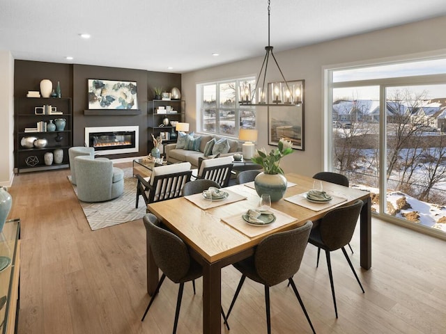 7881 Austin Way, Inver Grove Heights, MN 55077 - dining space featuring light wood finished floors, healthy amount of natural light, a chandelier, and recessed lighting