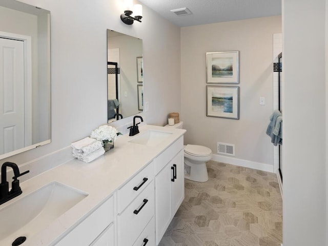 7881 Austin Way, Inver Grove Heights, MN 55077 - full bathroom featuring double vanity and toilet