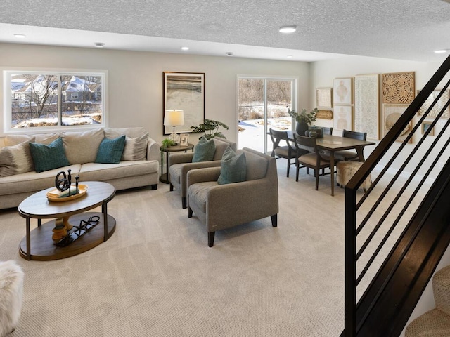 7881 Austin Way, Inver Grove Heights, MN 55077 - living room with light carpet, a textured ceiling, and recessed lighting