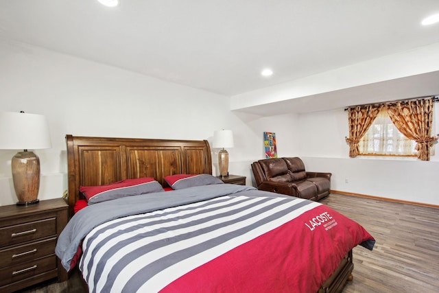 bedroom featuring recessed lighting, baseboards, and wood finished floors