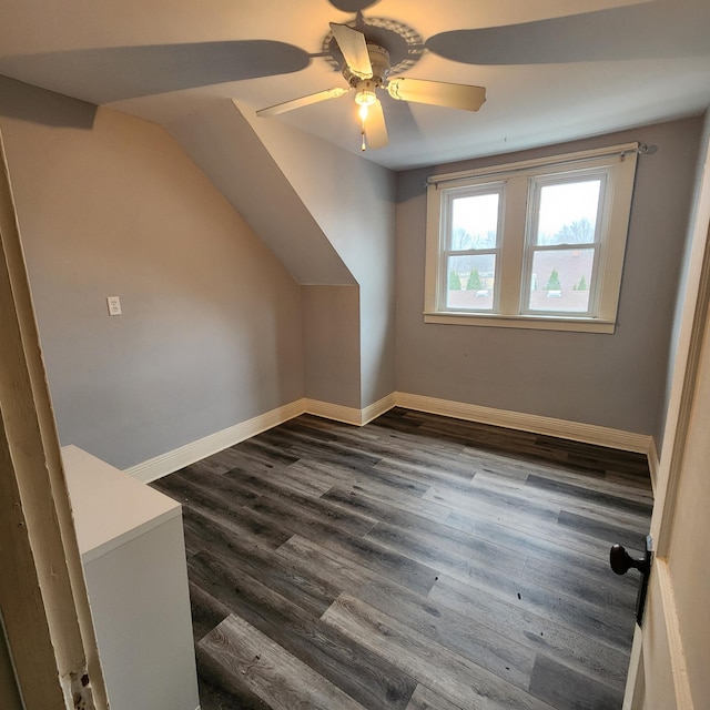 307 11th St NW, Willmar, MN 56201 - additional living space with vaulted ceiling, baseboards, a ceiling fan, and dark wood finished floors