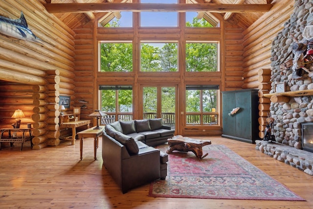 6070 Pilger Ave NW, Annandale, MN 55302 - living room featuring high vaulted ceiling, wooden ceiling with exposed beams, rustic walls, and hardwood / wood-style flooring